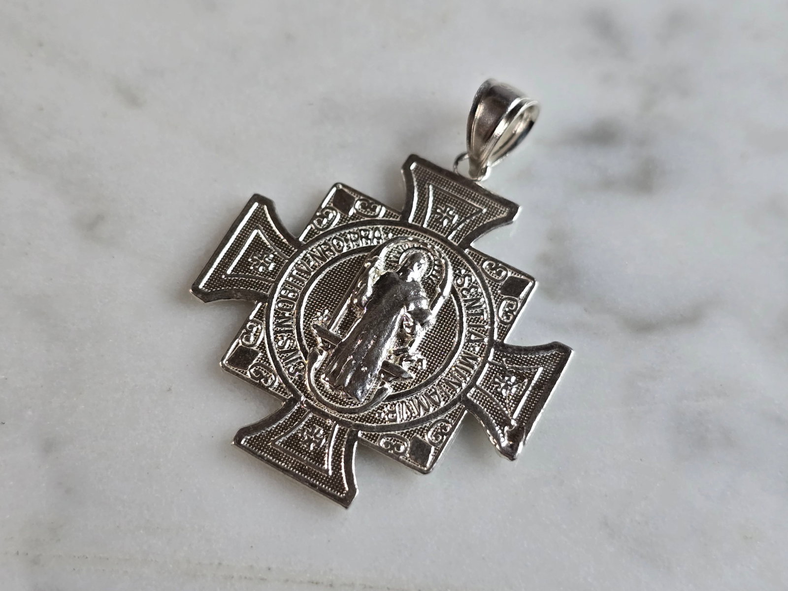 Religious Sterling Silver St. Benedict Cross Pendant: A RELIGIOUS STERLING SILVER ST. BENEDICT CROSS PENDANT. THE TOTAL WEIGHT IS 2.6g, AND MEASURES 1 1/4" BY 1" WIDE. MAKES A GREAT GIFT FOR THAT SPECIAL SOMEONE. ANY QUESTIONS, PLEASE DO NOT HESITATE TO 