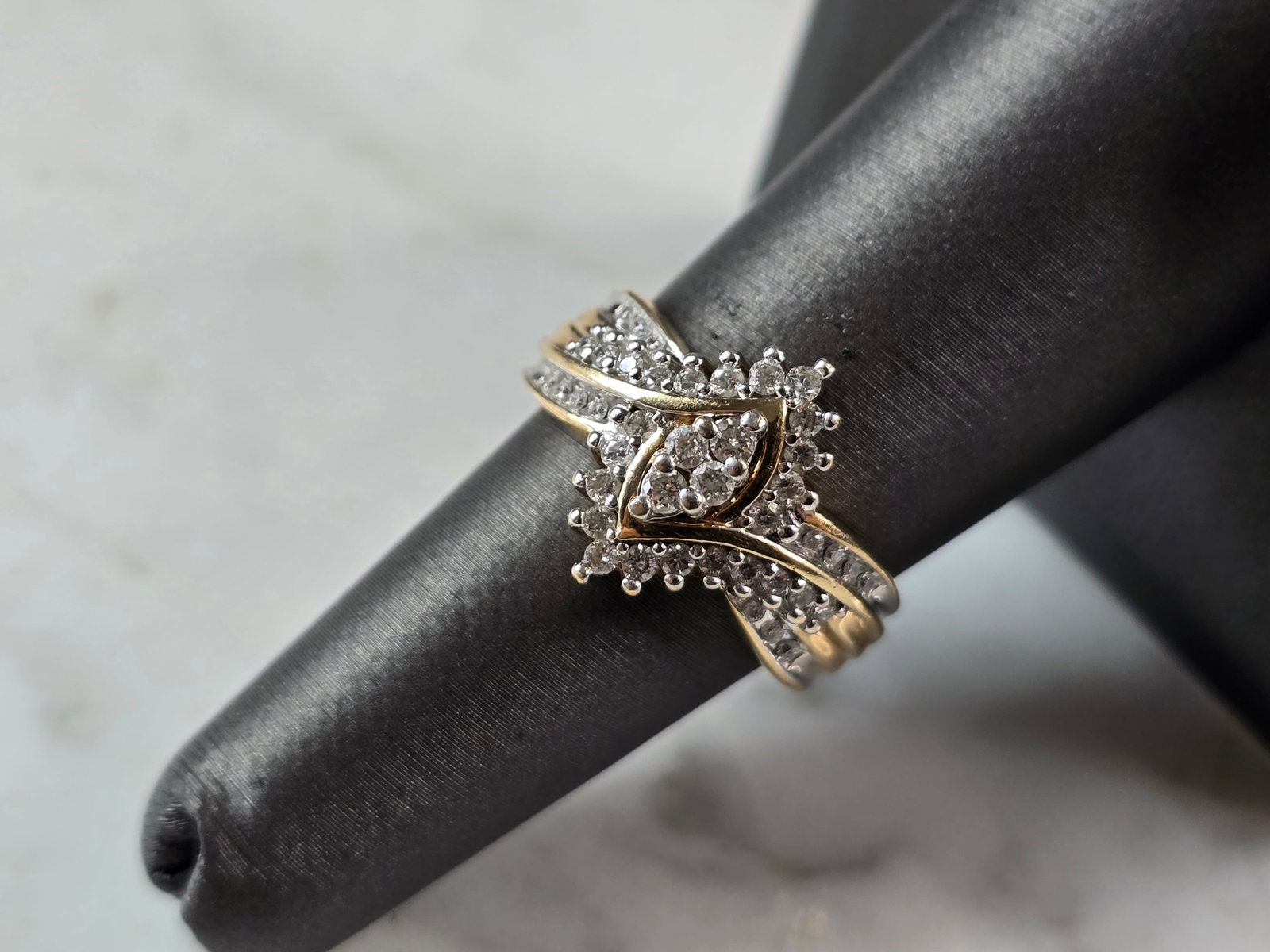 Womens Vintage Estate 10K Yellow & White Gold Diamond Keepsake Ring: A WOMENS VINTAGE ESTATE 10K YELLOW & WHITE GOLD DIAMOND KEEPSAKE RING. THE RING IS A SIZE 7.0, AND WEIGHS 5.5g. THERE ARE 44 TINY DIAMONDS. THE WIDTH OF THE RING IS 1/2". THIS IS A BEAUTIFUL GIFT FOR 