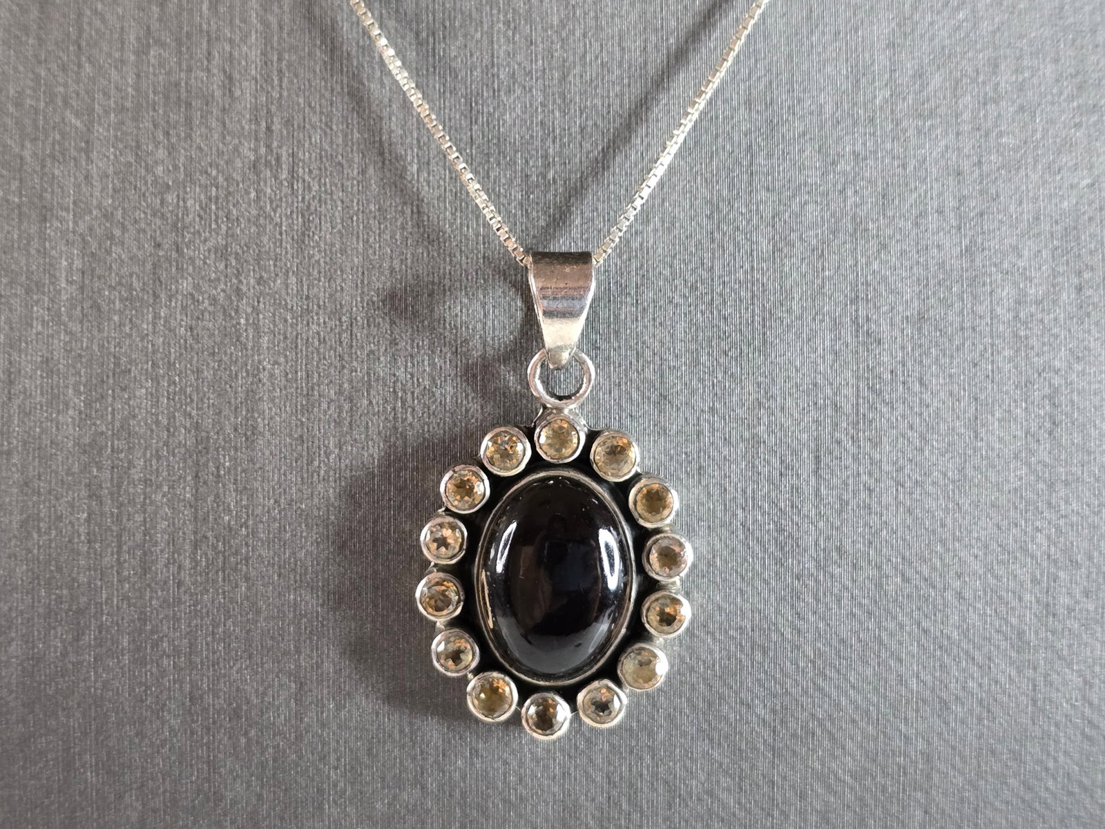 Womens Vintage Estate Sterling Silver Smokey Quartz Pendant Necklace: A WOMENS VINTAGE ESTATE STERLING SILVER SMOKEY QUARTZ PENDANT WITH NECKLACE. PENDANT AND NECKLACE WEIGH 9.3g. NECKLACE MEASURES 18 3/8", AND THE PENDANT MEASURES 1 3/8" LONG BY 3/4" WIDE. NOT SURE IF 