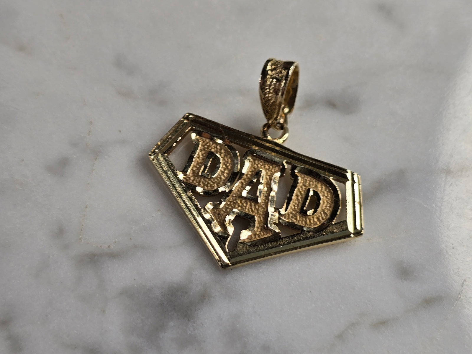 Mens Vintage Estate 14K Yellow Gold DAD Pendant: A MENS VINTAGE ESTATE 14K YELLOW GOLD "DAD" PENDANT. THE PENDANT WEIGHS 2.5g, AND MEASURES 1" LONG BY 1" WIDE. MAKES A GREAT GIFT FOR THAT SOMEONE SPECIAL. ANY QUESTIONS, PLEASE ASK. BE SURE TO CHECK 