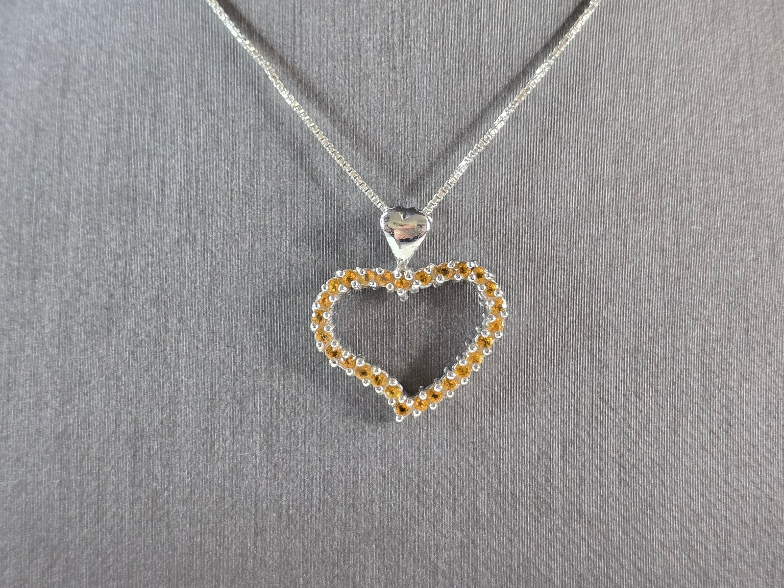 Womens Vintage Estate Sterling Silver Citrine Heart Pendant Necklace: A WOMENS VINTAGE ESTATE STERLING SILVER CITRINE HEART PENDANT WITH NECKLACE. TOGETHER THEY WEIGH 4.9g. NECKLACE MEASURES 18" LONG AND PENDANT MEASURES 1" BY 7/8". NOT SURE IF THE STONES ARE NATURAL OR