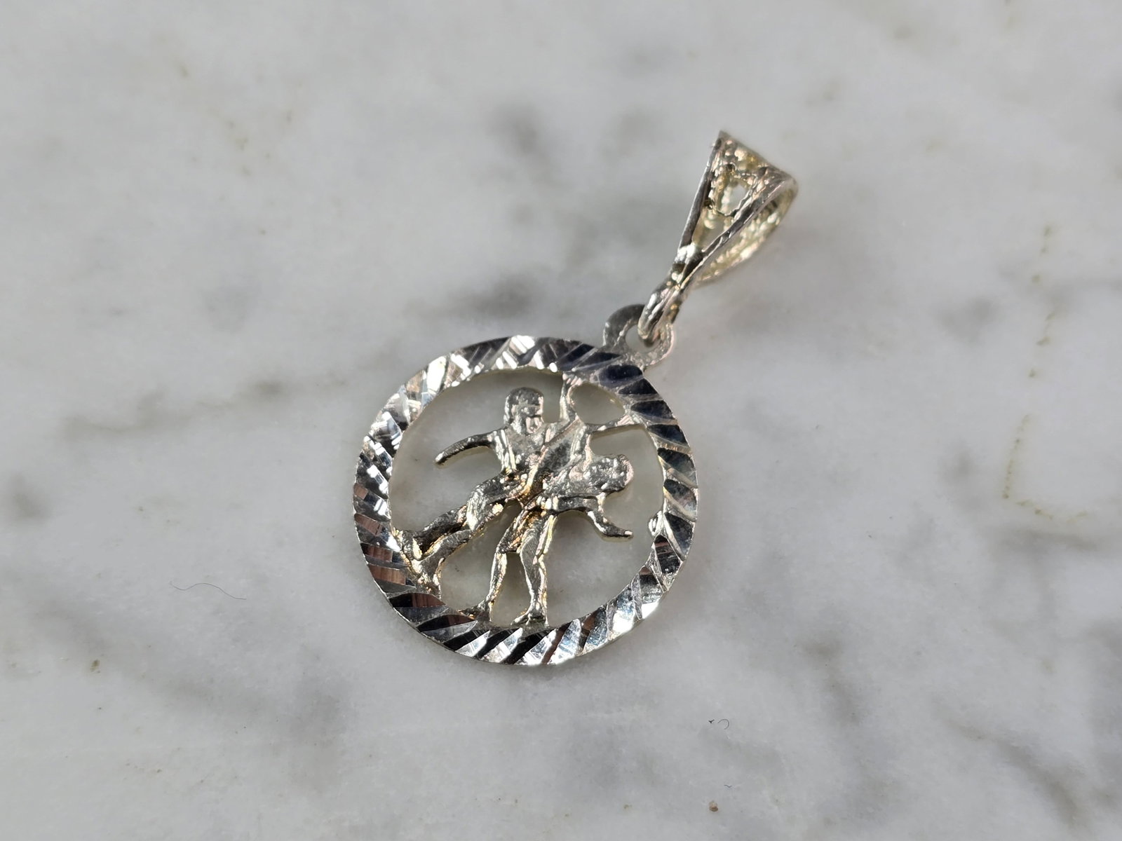 Womens Vintage Estate Sterling Silver Zodiac Gemini Pendant: A WOMENS VINTAGE ESTATE STERLING SILVER ZODIAC GEMINI PENDANT. THE PENDANT WEIGHS 1.2g AND MEASURES 1 1/8" LONG BY 5/8" WIDE. PENDANT IS MISMARKED 14K. PENDANT IS STERLING SILVER. MAKES A GREAT GIFT F