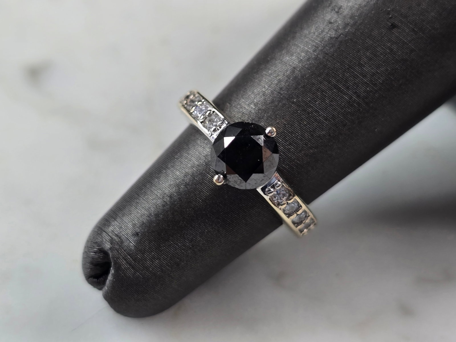 Womens 18K White Gold Black Moissanite Diamond Ring: FOR SALE IS THIS VINTAGE ESTATE 18K WHITE GOLD BLACK MOISSANITE DIAMOND RING. THE RING IS A SIZE 4.0 AND WEIGHS 4.6g. THE CENTER MOISSANITE STONE IS ABOUT .85cts, AND THERE ARE ABOUT .24cts OF DIAMOND