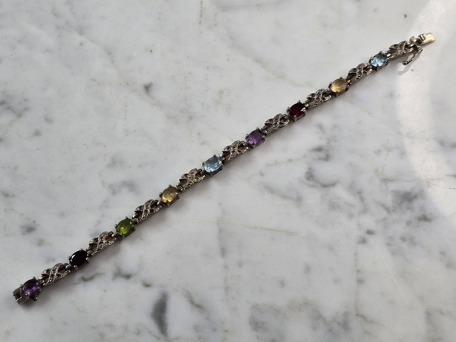 Womens Vintage Sterling Silver Multi Stone Bracelet: FOR SALE IS A LOVELY VINTAGE ESTATE .925 STERLING SILVER MULTI STONE BRACELET. NOT SURE IF STONES ARE REAL OR MAN MADE. BRACELET MEASURES 7 1/2" LONG BY 1/4" WIDE AND WEIGHS 16.9g. THIS WOULD MAKE A L