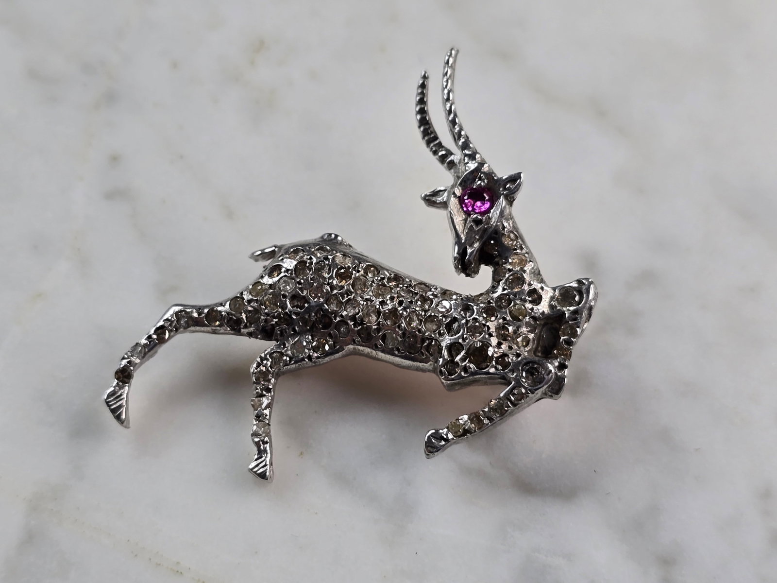 Women Vintage Estate 14k White Gold Diamond Stag Brooch: A womens vintage estate 14k white gold diamond stag brooch. Piece weighs 9.1g and measures 1 3/4" long by 1 3/4" wide. There are about 2.35cts of diamonds. There are 3 diamonds missing, however you ca