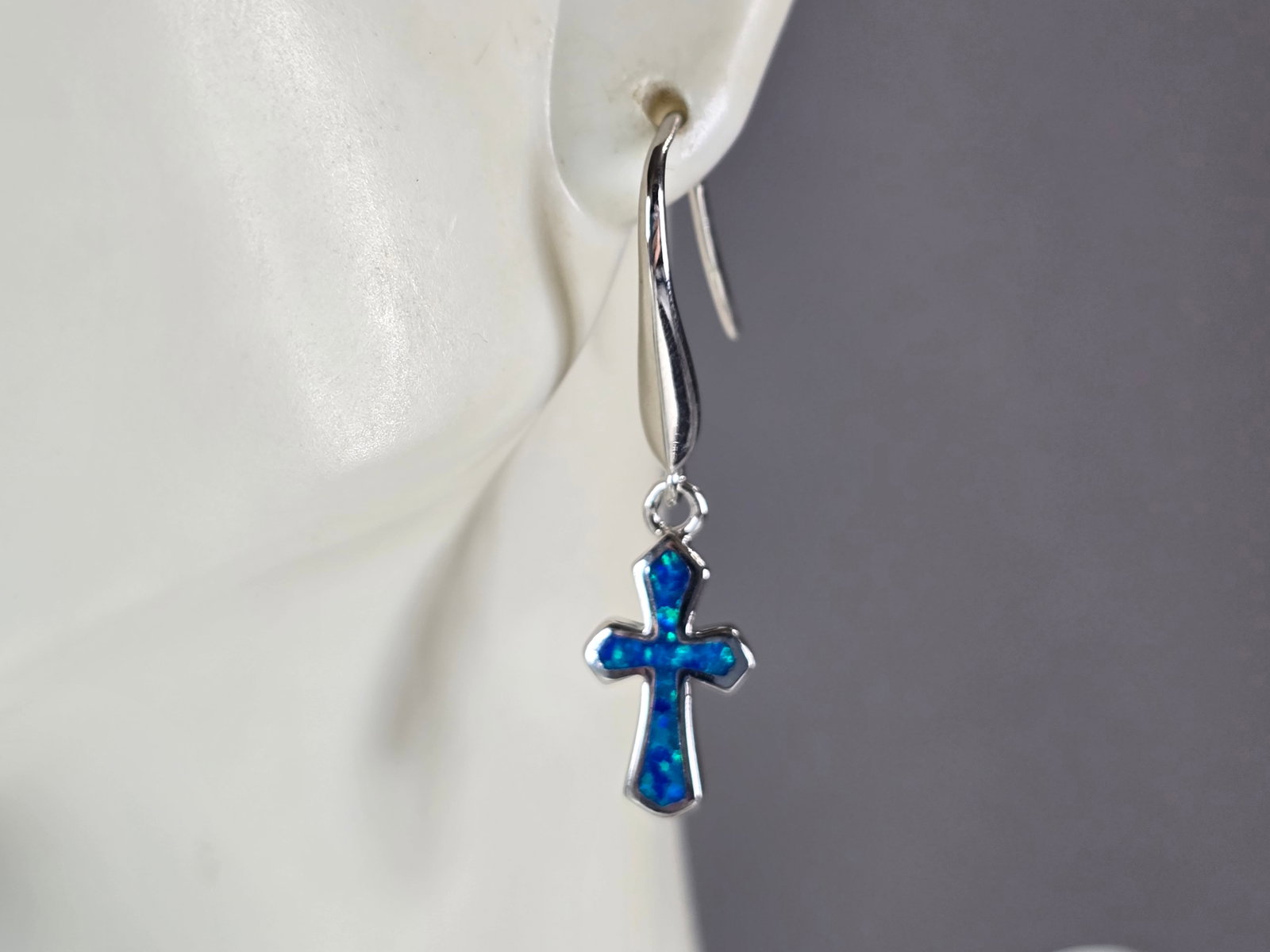 Womens Estate Sterling Silver Blue Opal Religious Cross Earrings: A PAIR OF WOMENS STERLING SILVER BLUE OPAL COLORED RELIGIOUS CROSS EARRINGS THAT WEIGH 4.1g AND MEASURES 1 3/8" LONG BY 3/8" WIDE. NOT SURE IF STONES ARE REAL OR MAN MADE. ANY QUESTIONS, PLEASE DO NOT
