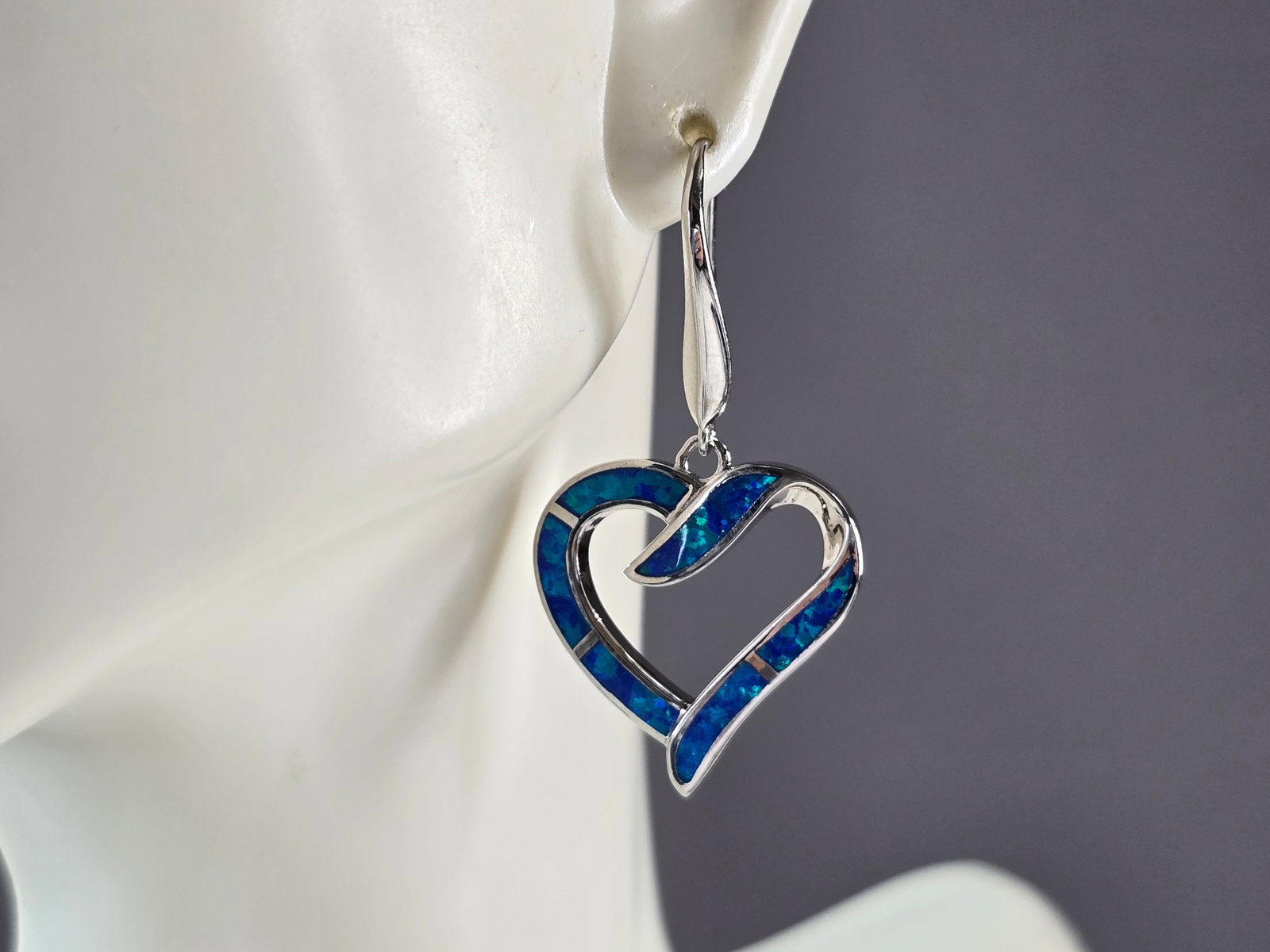 Womens Estate Sterling Silver Blue Opal Heart Earrings: A PAIR OF WOMENS STERLING SILVER BLUE OPAL COLORED HEART EARRINGS THAT WEIGH 8.2g AND MEASURES 1 5/8" LONG BY 7/8" WIDE. NOT SURE IF STONES ARE REAL OR MAN MADE. ANY QUESTIONS, PLEASE DO NOT HESITATE 