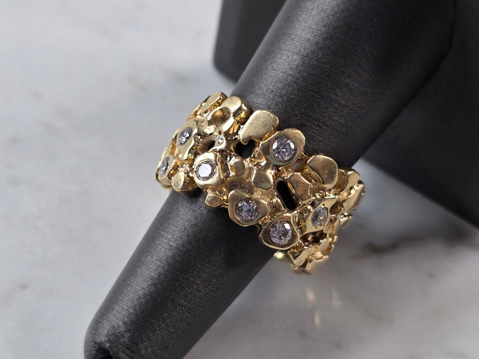 Mens Vintage Estate 14K Gold Diamond Nugget Ring: A MENS VINTAGE ESTATE 14K GOLD DIAMOND NUGGET RING. THE RING IS A SIZE 10.75, AND WEIGHS 17.3g. THERE ARE ABOUT .70cts OF DIAMONDS IN THIS RING. WIDTH OF THE RING IS 1/2". RING IS NOT MARKED BUT IT HA