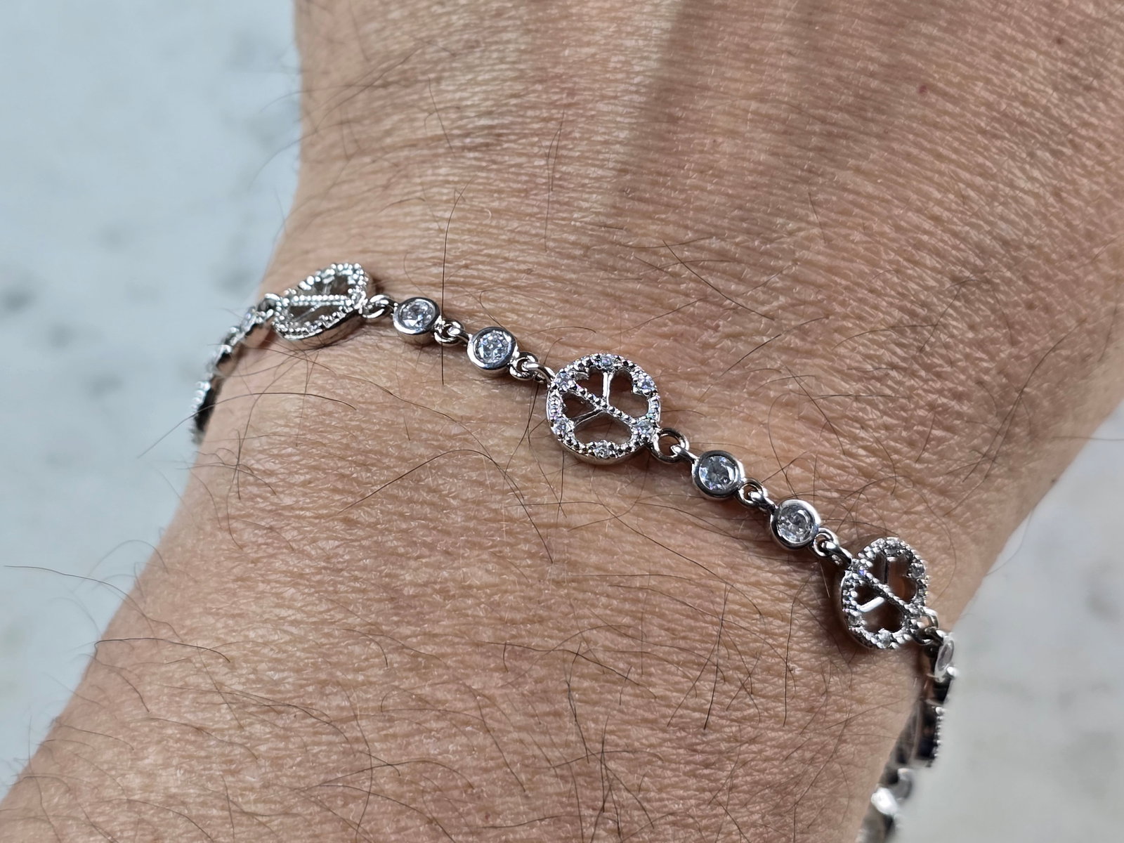 Womens Sterling Silver CZ Anklet Peace Bracelet: A WOMENS STERLING SILVER CZ ANKLET PEACE BRACELET. BRACELET IS ABOUT 8 7/8" LONG BY 3/8" WIDE, AND WEIGHS 8.8g. WOULD MAKE A LOVELY GIFT FOR THAT SOMEONE SPECIAL. BE SURE TO CHECK OUT SOME OF MY OTHER