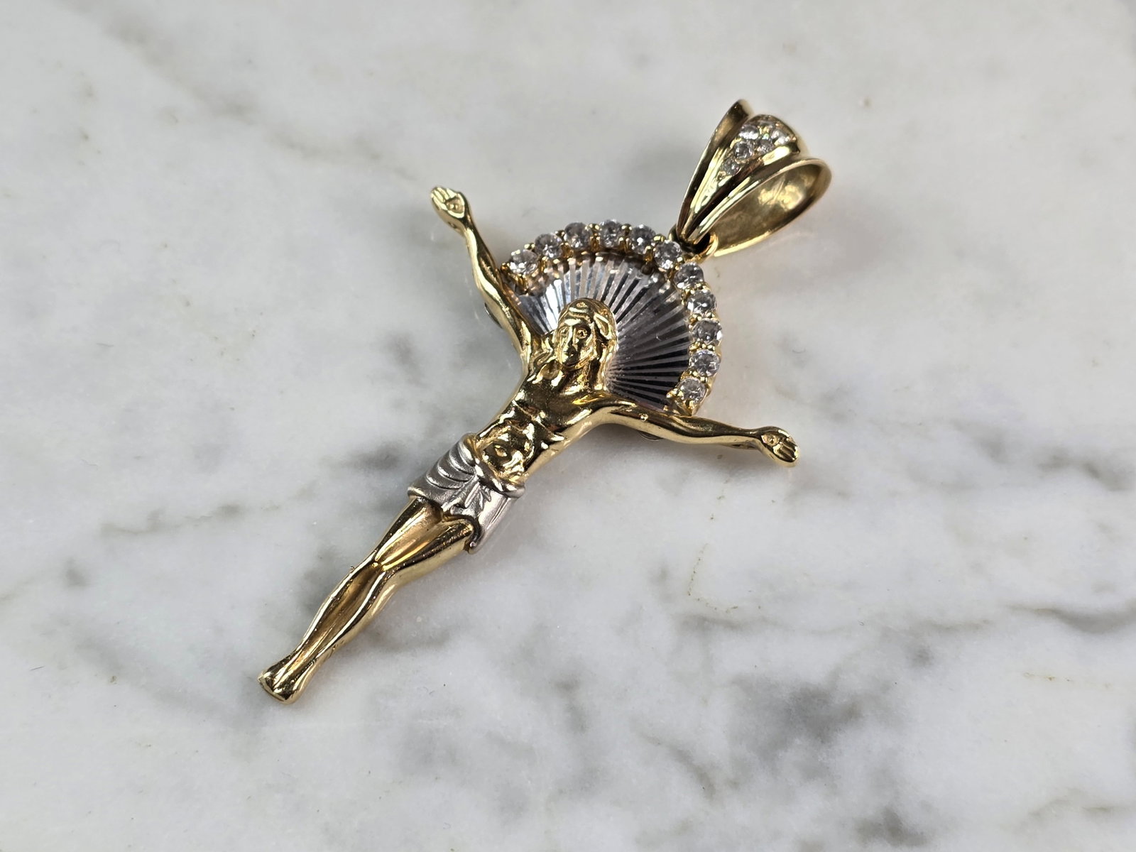 Vintage Estate 14K Gold & CZ Religious Jesus on Cross Pendant: A VINTAGE ESTATE 14K YELLOW GOLD & CZ JESUS ON A CROSS PENDANT. THE PENDANT WEIGHS 8.2g AND MEASURES 2 1/4" LONG BY 1 3/8" WIDE. CROSS HAS MIX OF YELLOW GOLD AND WHITE GOLD IN IT. MAKES A GREAT GIFT F