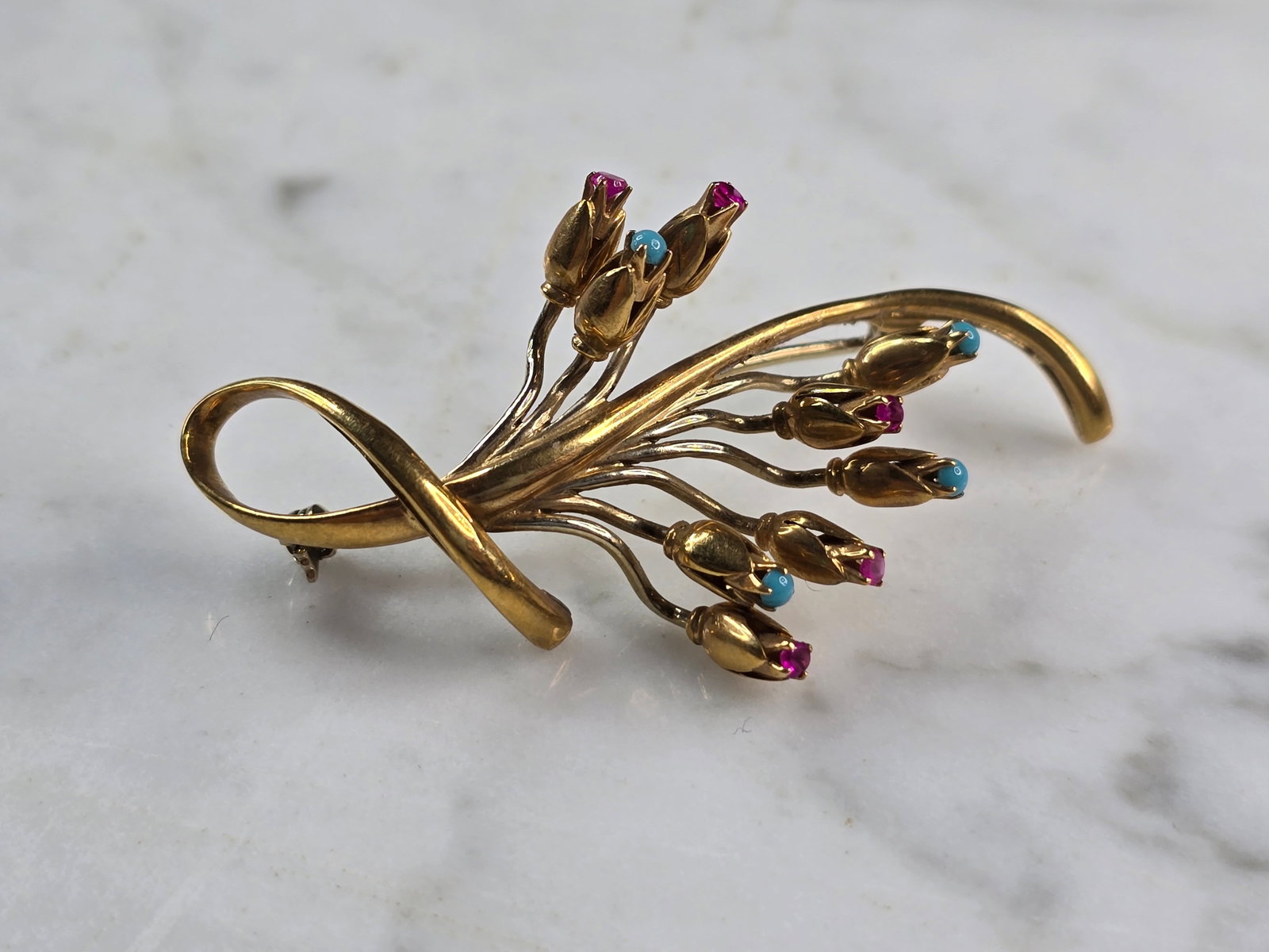 Womens Vintage Estate 14K Yellow Gold Flower Brooch: FOR SALE IS THIS LOVELY VINTAGE ESTATE 14K YELLOW GOLD RUBIES AND TURQUOISE FLOWER BROOCH. NOT SURE IF THE STONES ARE NATURAL OR MAN MADE. THE BROOCH MEASURES 2 1/8" LONG BY 1 1/8" WIDE, AND WEIGHS 9.
