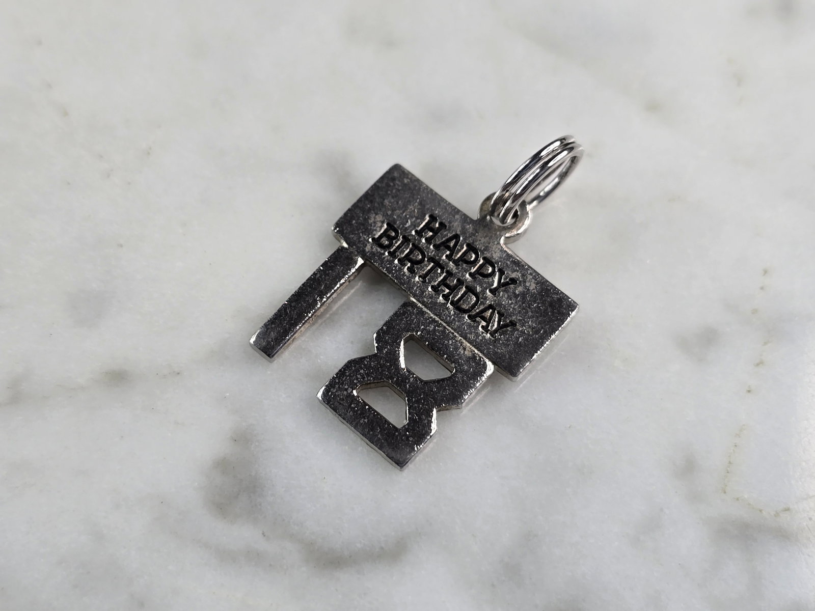 Womens Vintage Sterling Silver 18th Birthday Charm: FOR SALE IS THIS WOMENS VINTAGE ESTATE STERLING SILVER 18TH BIRTHDAY CHARM. CHARM WEIGHS 1.7g AND CHARM MEASURES 7/8" LONG BY 5/8" WIDE. MAKES A GREAT GIFT FOR THAT SOMEONE SPECIAL. ANY QUESTIONS, PLE