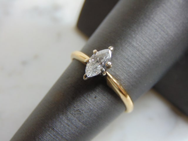 Womens Vintage Estate 14K Gold Marquise Diamond Ring: A BEAUTIFUL VINTAGE 14K GOLD WOMEN'S ENGAGEMENT RING WITH A MARQUIS CUT DIAMOND THAT IS ABOUT .38cts. THE SIZE OF THE RING IS A 7.25, AND WEIGHS 2.0g. NOT SURE OF THE COLOR OR CLARITY OF THE DIAMOND, 