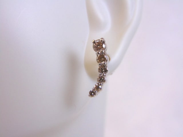 Pr of Womens 14K White Gold Diamond Earrings: A PAIR OF 14K WHITE GOLD DIAMOND EARRINGS WITH APPROXIMATELY .69cts OF DIAMONDS . THE EARRINGS WEIGH 2.6g, AND MEASURE 1/2" LONG BY 1/8" WIDE. THIS MAKES A LOVELY GIFT FOR THAT SOMEONE SPECIAL. ANY QU