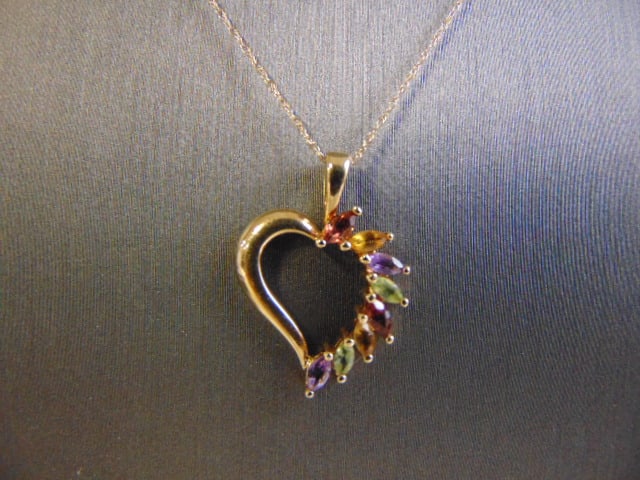Womens Vintage 14K Gold Multi Stone Heart Pendant: FOR SALE IS THIS LOVELY WOMENS VINTAGE ESTATE 14K GOLD MULTI STONE HEART PENDANT WITH NECKLACE. THE NECKLACE AND PENDANT WEIGH 2.3g. NECKLACE MEASURES 18 1/2" LONG . THE PENDANT MEASURES 1" LONG BY 5/