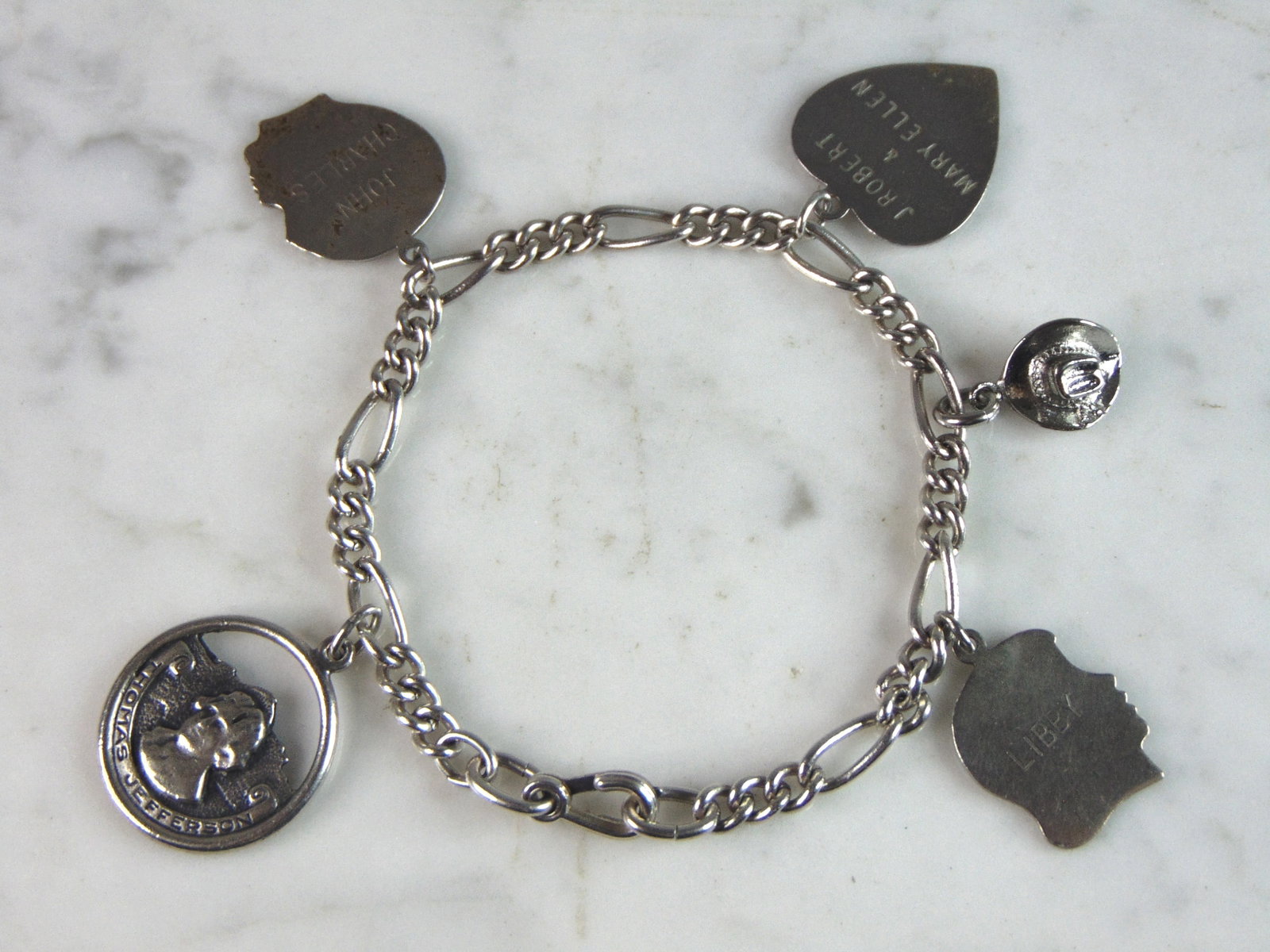 Womens Vintage Estate Sterling Silver Charm Bracelet: FOR SALE IS A LOVELY VINTAGE ESTATE STERLING SILVER CHARM BRACELET, THAT WEIGHS 22.5g. THE BRACELET MEASURES 7 1/4" LONG BY 1/4" WIDE. BRACELET COMES WITH FIVE CHARMS. ANY QUESTIONS PLEASE DO NOT HESI