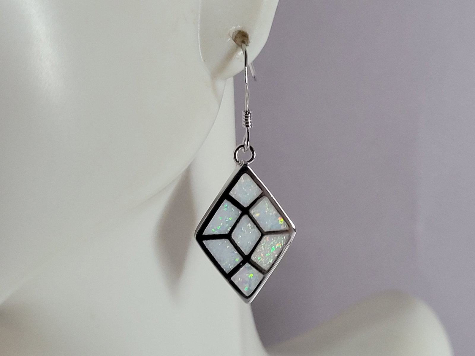 Womens Sterling Silver Modernist Opal Earrings: A PAIR OF WOMENS STERLING SILVER MODERNIST OPAL COLORED EARRINGS THAT WEIGH 6.3g AND MEASURES 1 1/2" LONG BY 5/8" WIDE. NOT SURE IF STONES ARE REAL OR MAN MADE. ANY QUESTIONS, PLEASE DO NOT HESITATE T