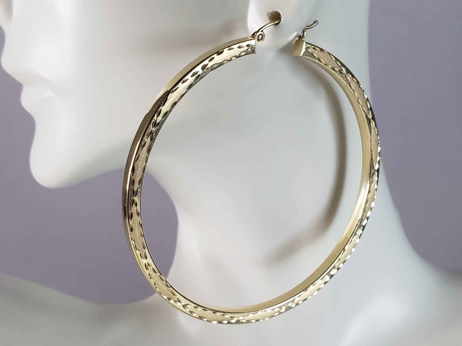 Pr Womens Vintage Estate 14K Yellow Gold Hoop Earrings: A PAIR OF WOMENS VINTAGE ESTATE 14K YELLOW GOLD ETCHED HOOP EARRINGS. THE EARRING WEIGH 7.4g, AND MEASURE 2 1/2" BY 2 1/2". EARRINGS ARE MARKED ON THE CLASP, AND ARE HOLLOW. WOULD MAKE A GREAT GIFT FO