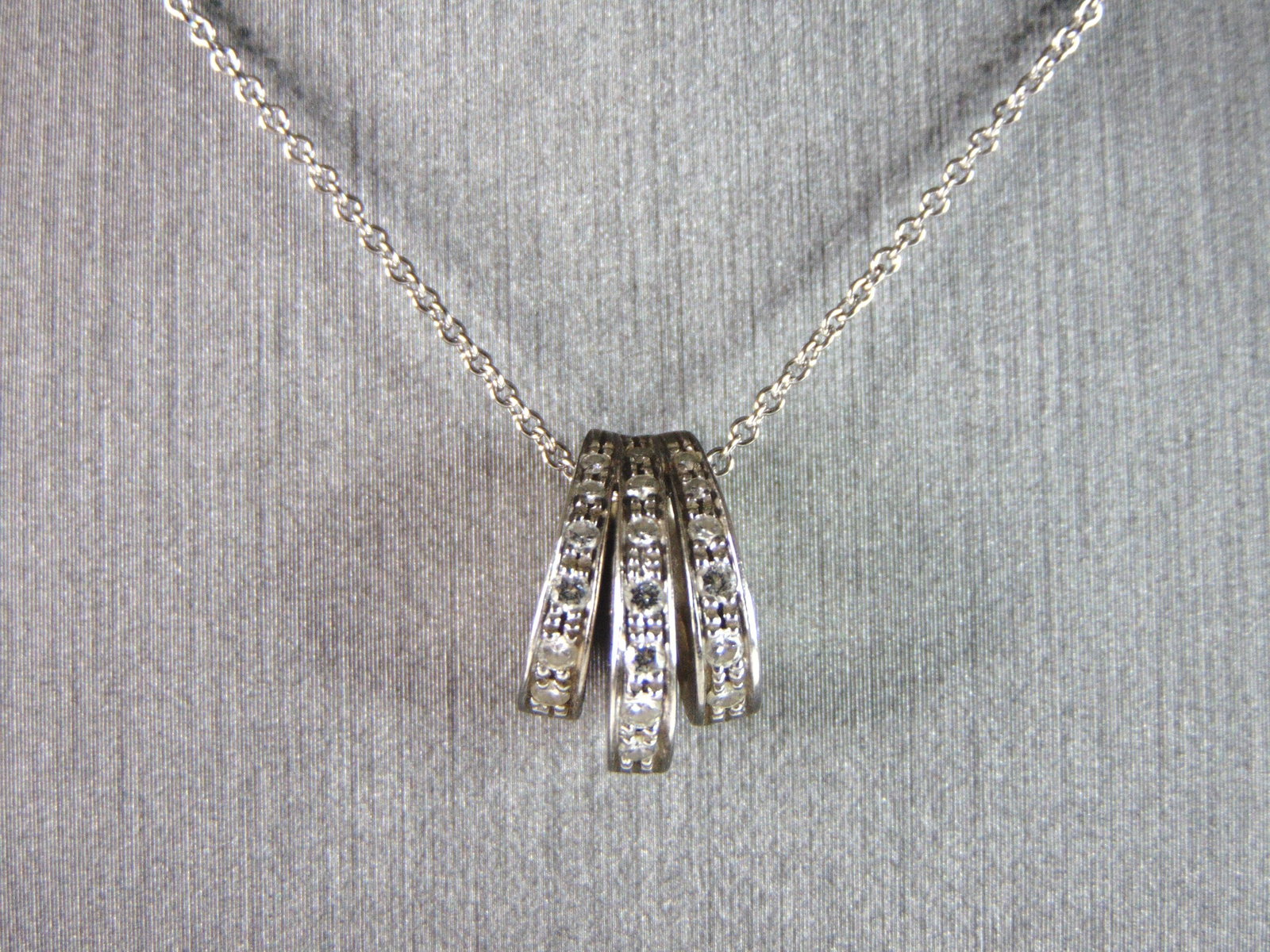 Womens Vintage Estate 18k White Gold & Diamonds Modernist Pendant Necklace: A VINTAGE ESTATE 18K WHITE GOLD AND DIAMOND MODERNIST PENDANT WITH NECKLACE. TOTAL WEIGHT IS 4.7g AND THE NECKLACE MEASURES 17 1/4" LONG, PENDANT MEASURES 1/2" BY 3/8" WIDE. THERE IS ABOUT .19cts OF D