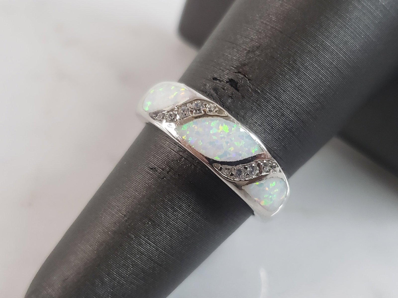 Womens Sterling Silver Modernist Opal Ring: A WOMENS STERLING SILVER MODERNIST OPAL RING. THE RING IS A SIZE 6.0 AND WEIGHS 4.1g. THE WIDTH OF THE RING IS 1/4". THE RING MAKES A BEAUTIFUL GIFT FOR THAT SOMEONE SPECIAL. ANY QUESTIONS, PLEASE ASK