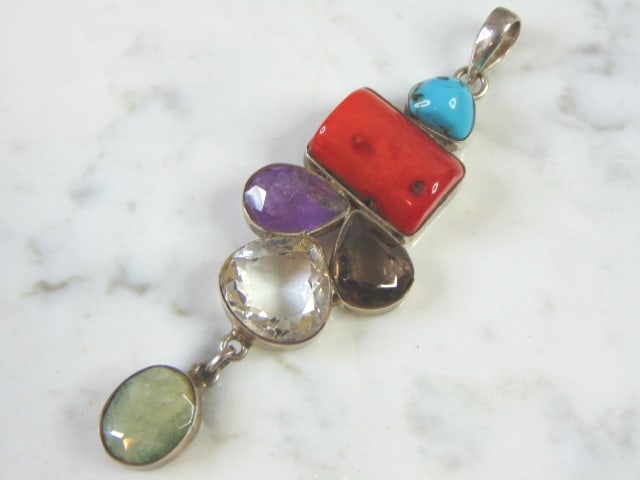 Womens Vintage Sterling Silver Multi-Stone Pendant: A WOMENS VINTAGE ESTATE STERLING SILVER MULTI STONE PENDANT. THE PENDANT WEIGHS 26.8g AND MEASURES 3 7/8" LONG BY 1 1/4" WIDE. MAKES A GREAT GIFT FOR THAT SOMEONE SPECIAL. IF ANY QUESTIONS, PLEASE ASK