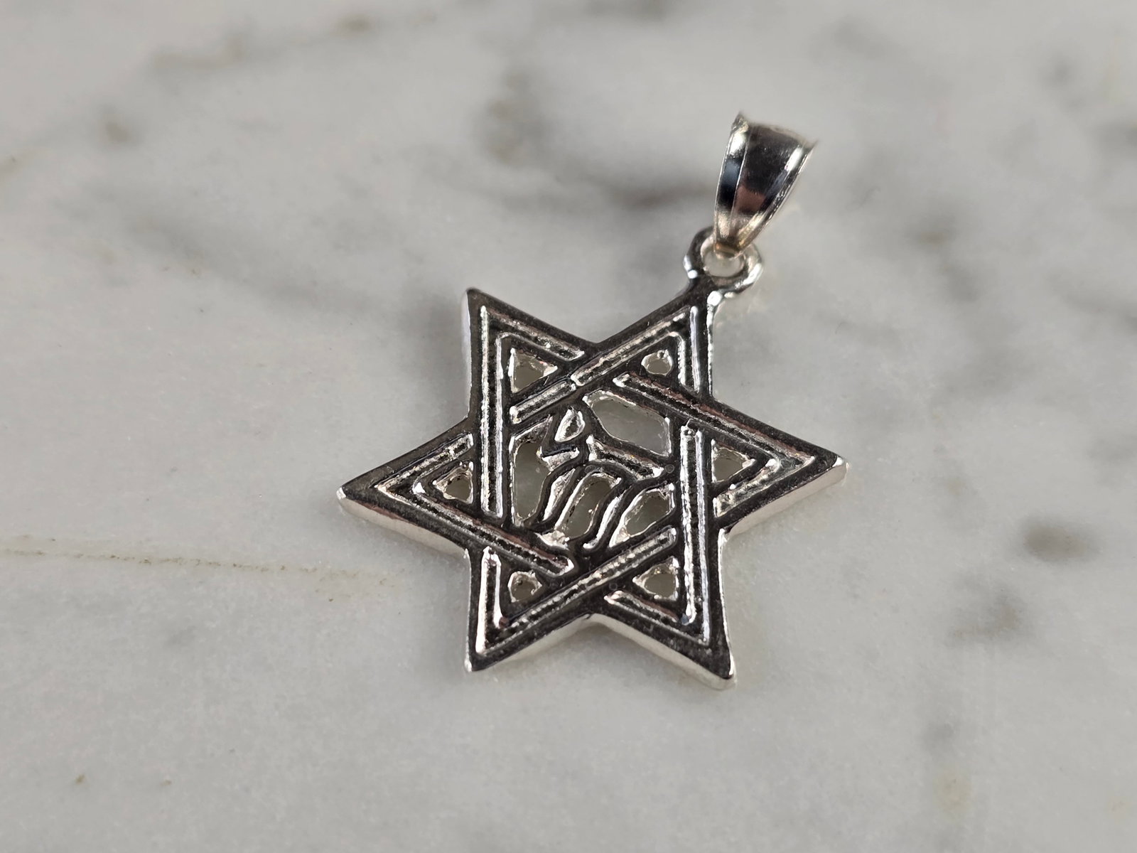Sterling Silver Jewish Judaica Star of David Chai Pendant: A VINTAGE ESTATE STERLING SILVER STAR OF DAVID CHAI PENDANT. THE PENDANT WEIGHS 2.0g AND MEASURES 1 1/8" LONG BY 3/4" WIDE. MAKES A GREAT GIFT FOR THAT SOMEONE SPECIAL. ANY QUESTIONS, PLEASE ASK. BE S