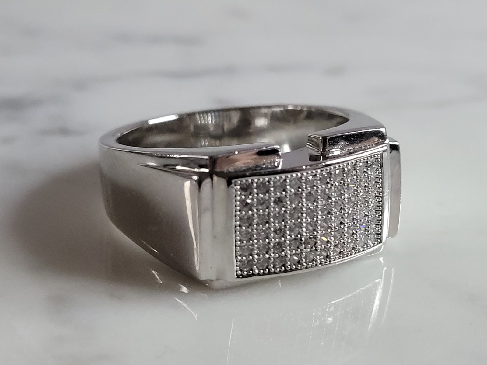 Mens Vintage Estate Sterling Silver CZ Ring: A MENS VINTAGE ESTATE STERLING SILVER CZ RING. THE RING IS A SIZE 13.0 AND WEIGHS 11.8g. THE WIDTH OF THE RING IS ABOUT 1/2". THE RING MAKES A BEAUTIFUL, IMPRESSIVE GIFT FOR THAT SOMEONE SPECIAL. ANY 