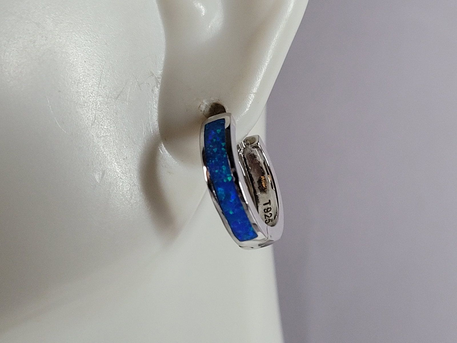 Womens Sterling Silver Modernist Blue Opal Earrings: A PAIR OF WOMENS STERLING SILVER BLUE OPAL COLORED EARRINGS THAT WEIGH 3.0g AND MEASURES 1/2" LONG BY 1/8" WIDE. NOT SURE IF STONES ARE REAL OR MAN MADE. ANY QUESTIONS, PLEASE DO NOT HESITATE TO ASK. 