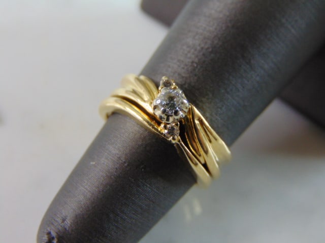 Womens Vintage Estate 14k Gold Diamond Ring: FOR SALE IS THIS UNIQUE VINTAGE 14K GOLD WOMEN'S 2 PIECE RING WITH DIAMONDS. THE RING IS A SIZE 4.75 AND WEIGHS 4.8g. THE CENTER DIAMOND IS ABOUT .10cts. TOTAL CARAT WEIGHT OF DIAMONDS IN THE RING IS 