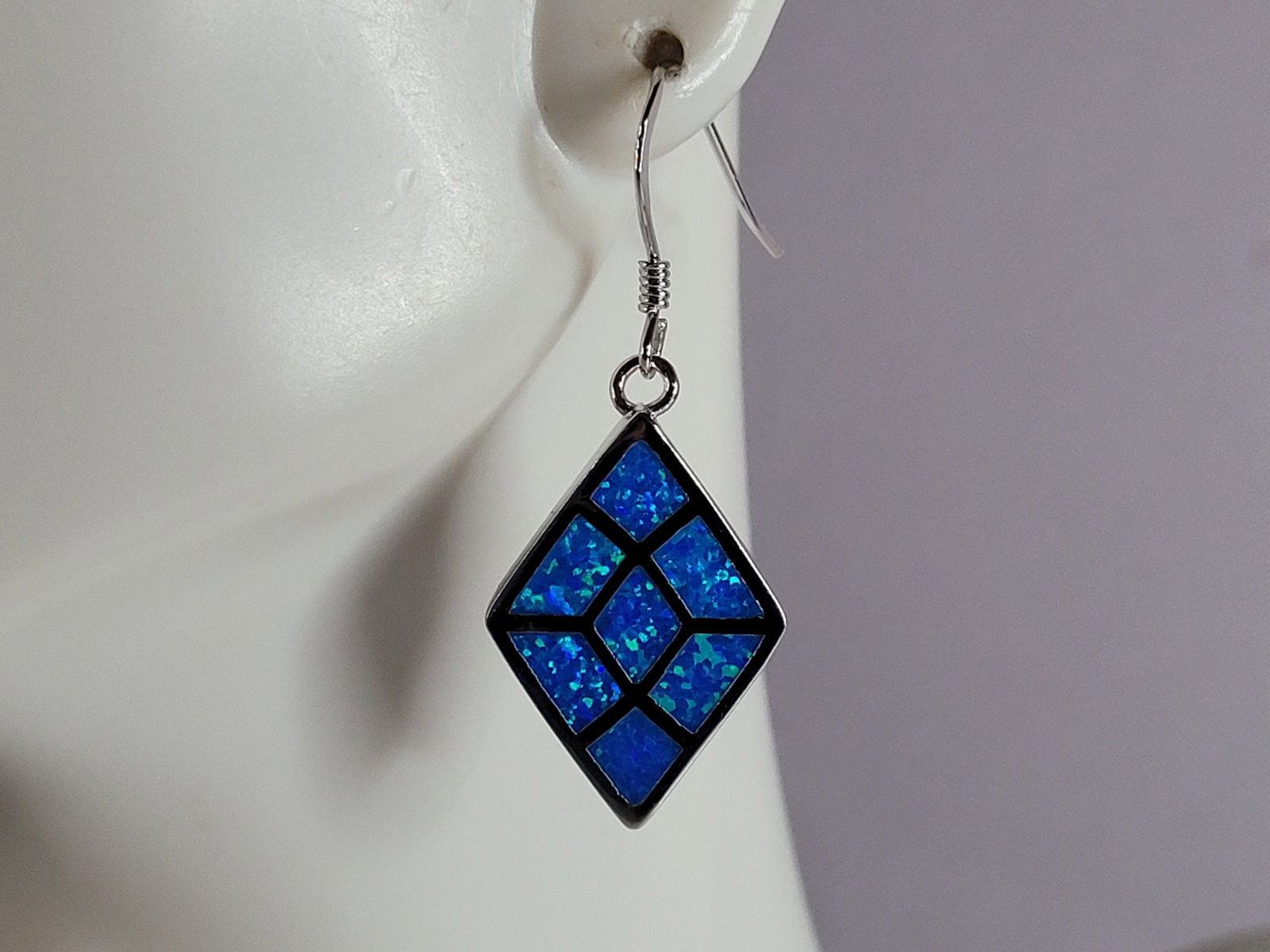 Womens Sterling Silver Modernist Blue Opal Earrings: A PAIR OF WOMENS STERLING SILVER MODERNIST BLUE OPAL COLORED EARRINGS THAT WEIGH 6.2g AND MEASURES 1 1/2" LONG BY 5/8" WIDE. NOT SURE IF STONES ARE REAL OR MAN MADE. ANY QUESTIONS, PLEASE DO NOT HESIT