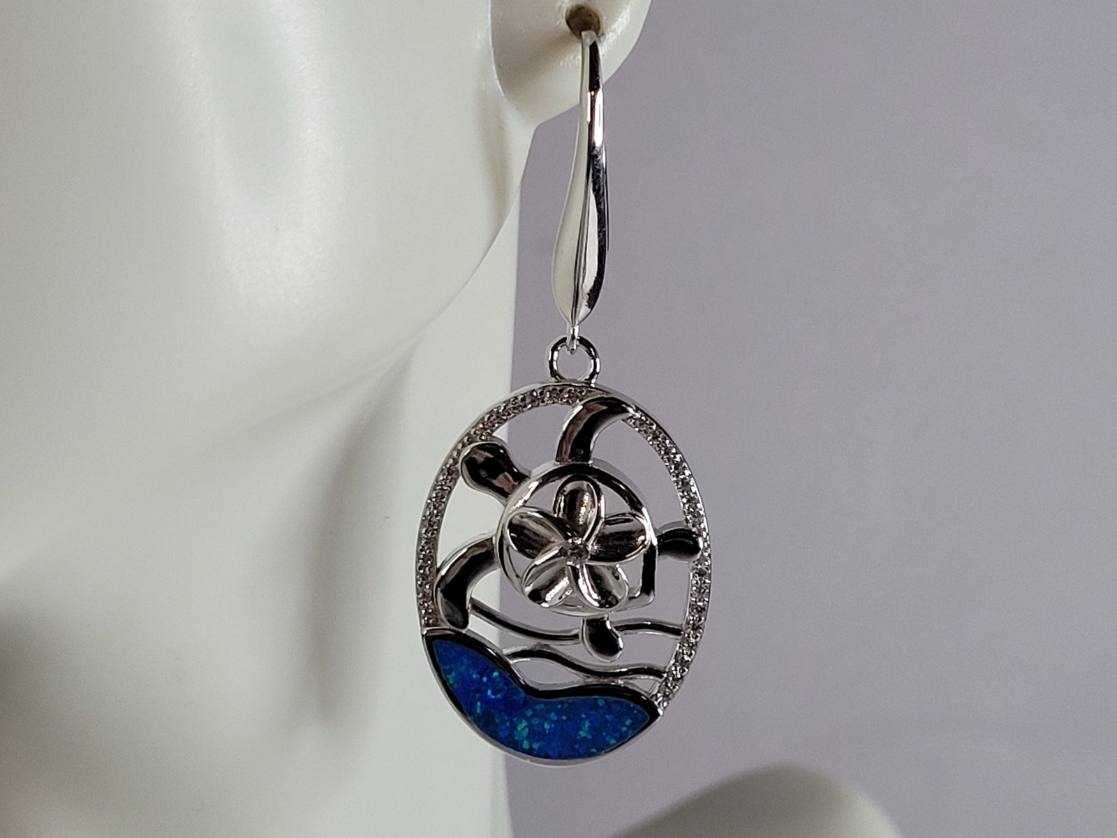 Womens Sterling Silver Opal Sea Turtle Earrings: A PAIR OF WOMENS STERLING SILVER BLUE OPAL COLORED SEA TURTLE EARRINGS THAT WEIGH 8.9g AND MEASURES 1 7/8" LONG BY 3/4" WIDE. NOT SURE IF STONES ARE REAL OR MAN MADE. ANY QUESTIONS, PLEASE DO NOT HESI