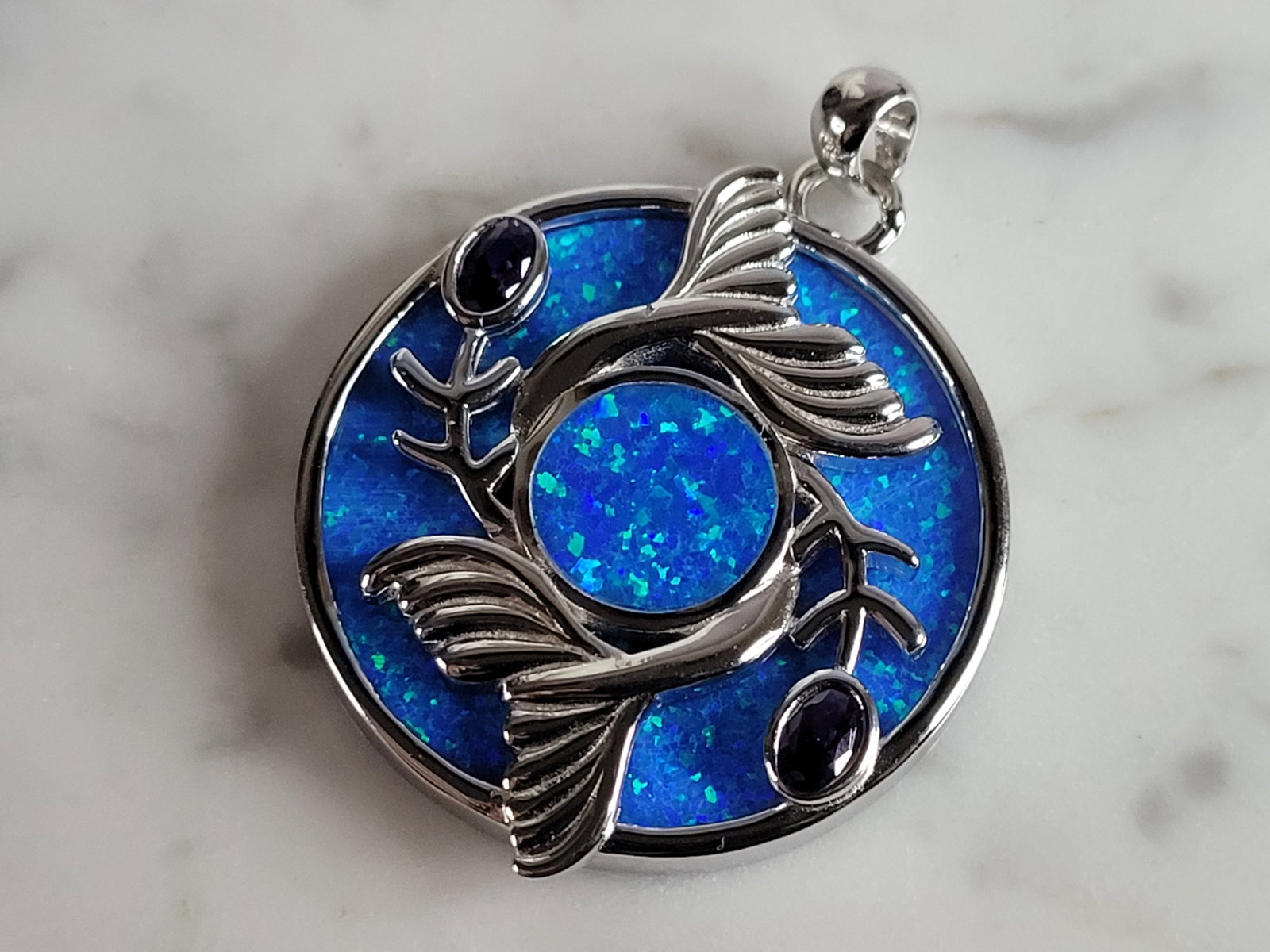 Womens Sterling Silver Blue Opal Koi Fish Pendant: A WOMENS STERLING SILVER BLUE OPAL KOI FISH PENDANT. NOT SURE IF STONES ARE REAL OR MAN MADE. THE PENDANT WEIGHS 10.7g AND MEASURES 1 1/2" LONG BY 1 1/4" WIDE. MAKES A GREAT GIFT FOR THAT SOMEONE SPEC