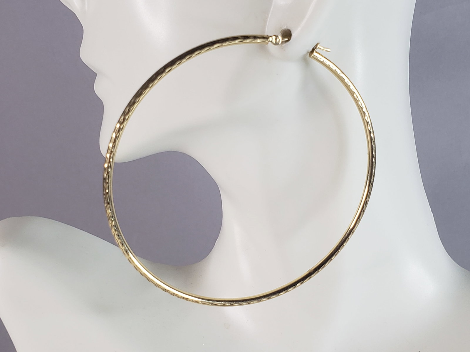 Pr of Womens Vintage Estate 14K Yellow Gold Hoop Earrings: A PAIR OF LARGE WOMENS VINTAGE ESTATE 14K YELLOW GOLD HOOP EARRINGS THAT WERE MADE IN ISRAEL. THE EARRING WEIGH 3.9g, AND MEASURE 2 1/2" BY 2 1/2". EARRINGS ARE MARKED ON THE CLASP, AND ARE HOLLOW. WO