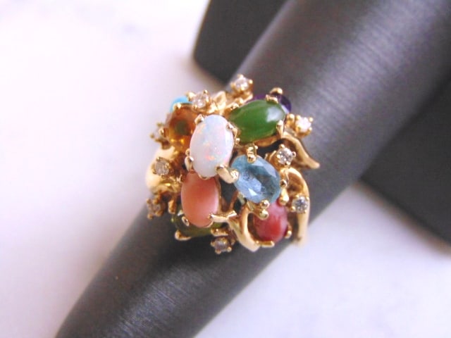 Unusual Womens 14K Gold Multi Stone Ring w/ Diamonds: FOR SALE IS THIS WONDERFUL WOMENS 14K YELLOW GOLD MULTI-STONE RING WITH DIAMONDS. THE RING WEIGHS 7.3g. THE SIZE OF THE RING IS A 6.75. THERE ARE ABOUT .27cts OF DIAMONDS. NOT SURE IF THE GEMSTONES AR