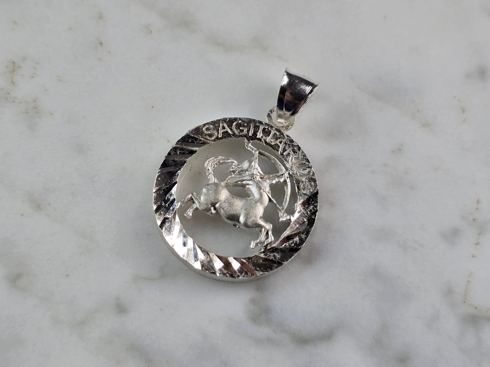 Womens Vintage Estate Sterling Silver Zodiac Sagittarius Pendant: A WOMENS VINTAGE ESTATE STERLING SILVER ZODIAC SAGITTARIUS PENDANT. THE PENDANT WEIGHS 4.1g, AND MEASURES 1 1/4" LONG BY 3/4" WIDE. PENDANT IS MARKED ON THE BALE. MAKES A GREAT GIFT FOR THAT SOMEONE S