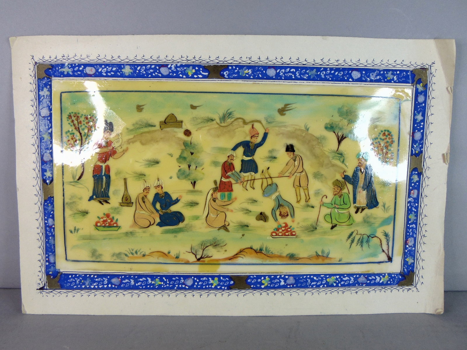 Vintage Decorative Persian Indian Mughal Hand Painted Party Scene: FOR SALE IS THIS VINTAGE DECORATIVE PERSIAN INDIAN MUGHAL HAND PARTY SCENE. NOT SURE WHAT MATERIAL IT WAS PAINTED ON. PAPER FRAME MEASURES 12 1/8" LONG BY 7 7/8" WIDE AND PAINTING MEASURES 9 3/4" LONG