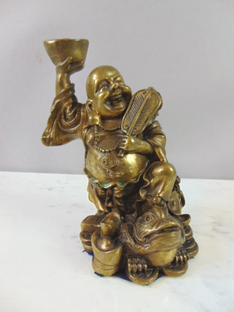 Decorative Laughing Buddha Brass Statue: A decorative laughing Buddha brass statue that measures 5" tall by about 4". Condition looks very nice. Any questions please do not hesitate to ask. Be sure to check out some of our other great items 