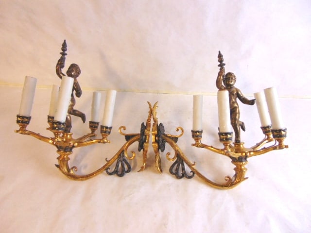 Pr Antique French Rococo Brass Cherub Wall Sconces: A beautiful pair of French antique rococo style brass wall sconces with cherub figures. Each sconce measures about 14" tall, by about 9" wide, and sticks out about 13 1/2" from the wall. Condition loo