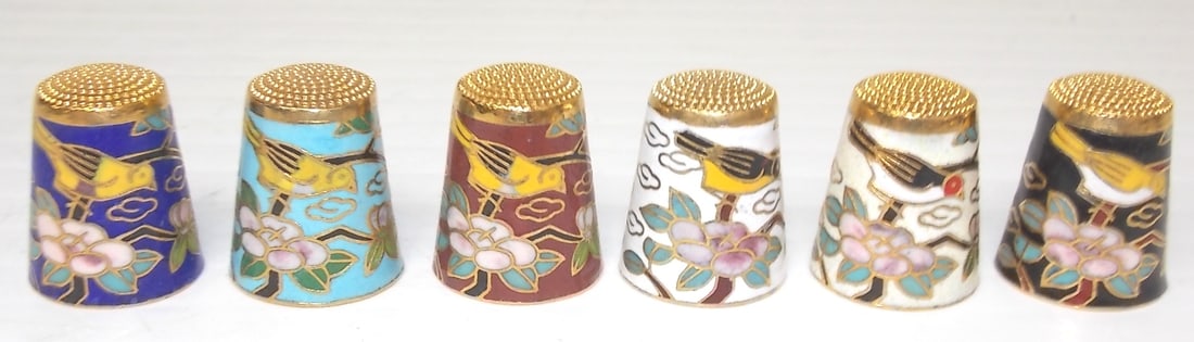 SET OF 6 CHINESE CLOISONNE THIMBLES: SET OF 6 CHINESE CLOISONNE THIMBLES WITH BIRD AND TREE BRANCH MOTIF EACH STAND 1" TALL AND MEASURES 3/4" IN DIAMETER. Note: This item tested positive for traces of gold by U. S. Customs agents. This i