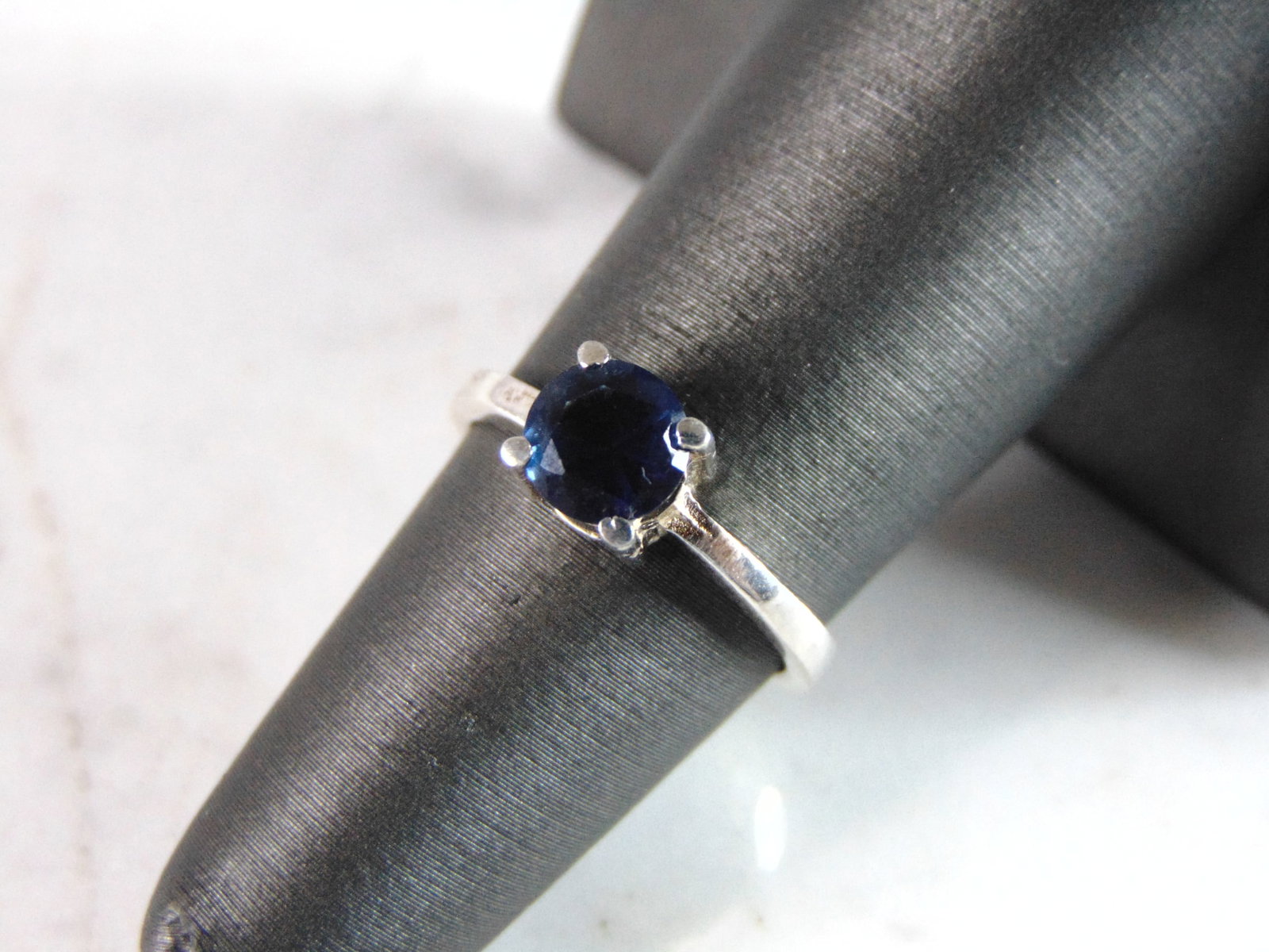 Womens Sterling Silver Ring w/ Sapphire Colored Stone: FOR SALE IS THIS WONDERFUL WOMENS STERLING SILVER RING WITH A SAPPHIRE COLORED STONE. NOT SURE IF THE STONE IS NATURAL OR MAN MADE. THE RING WEIGHS 2.3g. THE SIZE OF THE RING IS A 5.75. ANY QUESTIONS 