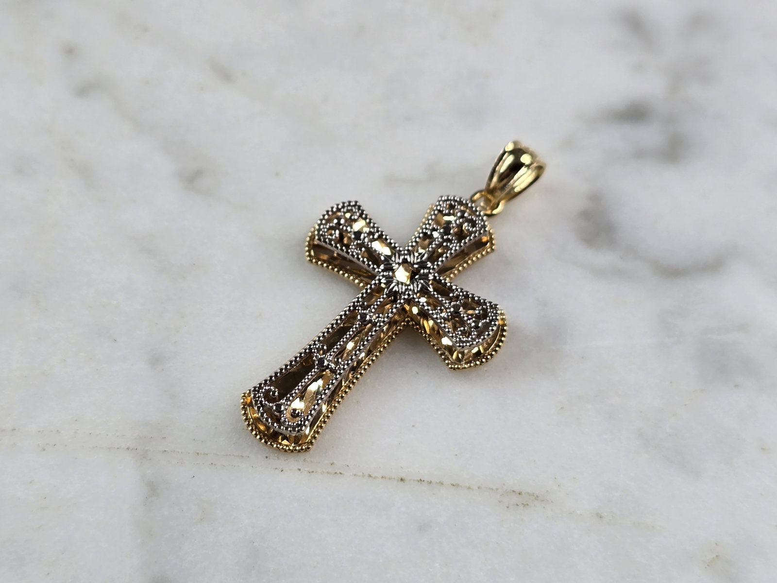Womens Vintage Estate 14K White & Yellow Gold Religious Cross Pendant: A WOMENS VINTAGE ESTATE 14K YELLOW & WHITE GOLD RELIGIOUS CROSS PENDANT. THE PENDANT WEIGHS 1.5g AND MEASURES 1 3/16" LONG BY 5/8" WIDE. PIECE IS MARKED 14K ON THE BALE. MAKES A GREAT GIFT FOR THAT SO