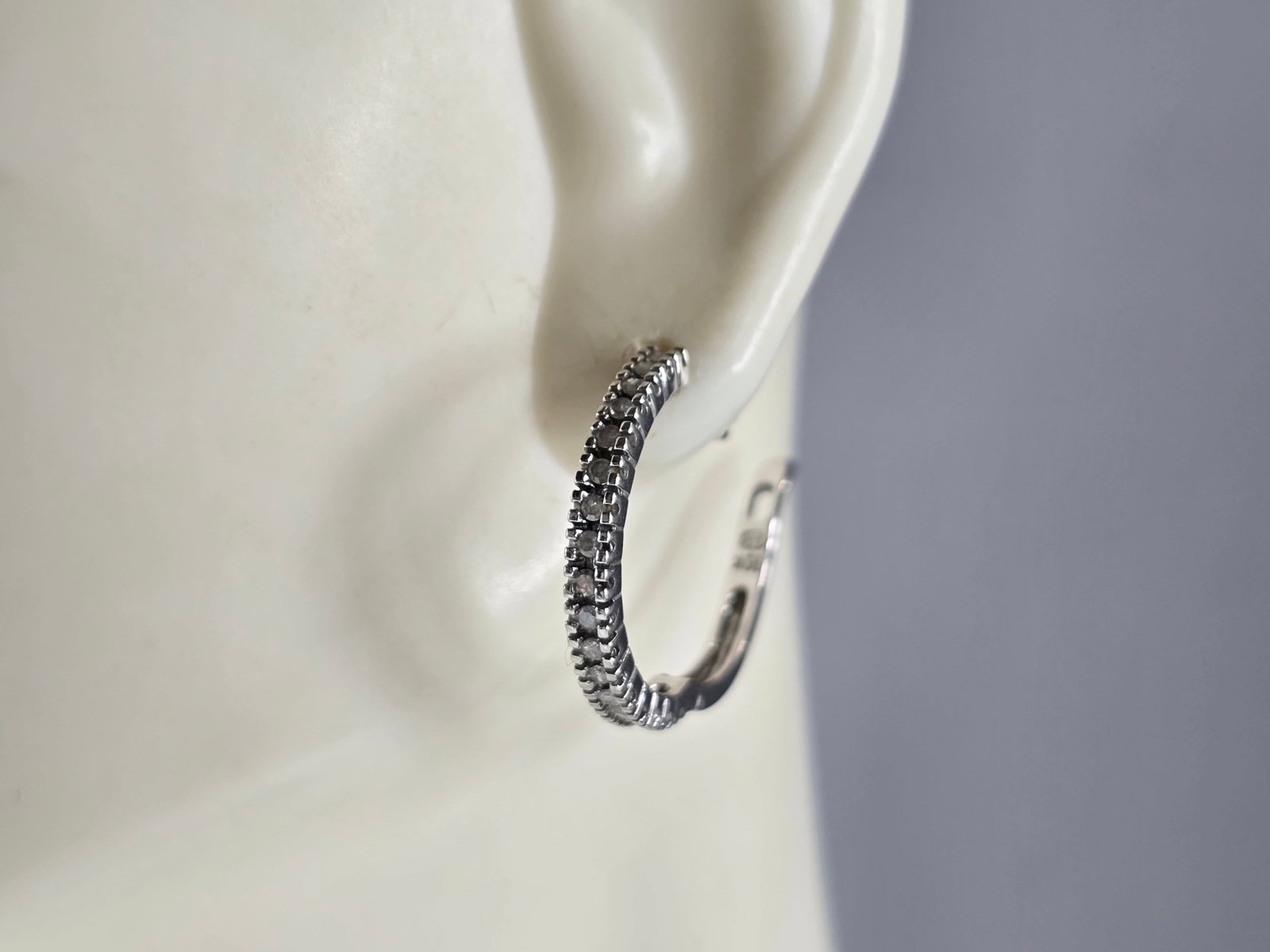 Pr Womens Vintage Estate 10K White Gold Diamond Hoop Earrings: A PAIR OF WOMENS VINTAGE ESTATE 10K WHITE GOLD DIAMOND HOOP EARRINGS. THE EARRINGS WEIGH 2.8g, AND MEASURE 3/4" LONG BY 5/8" WIDE. THERE ARE 34 TINY DIAMONDS TOTAL. MARKED 10K ON THE STEMS. THIS MAKES