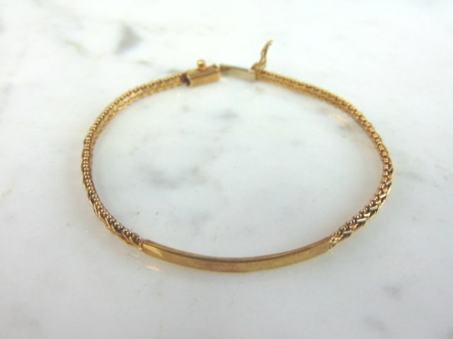 Womens Vintage Estate 14k Yellow Gold ID Bracelet: A WOMENS VINTAGE ESTATE 14K YELLOW GOLD THIN BAR ID BRACELET. THE BRACELET MEASURES 5 3/4" LONG BY 1/8" AND WEIGHS 6.0g. THE ID BAR MEASURES ABOUT 1 1/8" LONG. BRACELET IS STAMPED 14K. THIS MAKES A GR