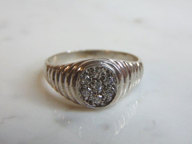 Womens Vintage Estate Sterling Silver CZ Ring: A WOMENS VINTAGE ESTATE STERLING SILVER RING WITH CZ STONES. THE RING SIZE IS A 11.0, AND WEIGHS 4.7g. THIS WOULD MAKE A NICE GIFT FOR THAT SOMEONE SPECIAL. ANY QUESTIONS PLEASE DO NOT HESITATE TO ASK
