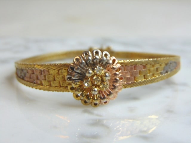 Womens Vintage Gold Tone Sterling Silver Bracelet: A WOMENS VINTAGE ESTATE GOLD TONE STERLING SILVER BRACELET THAT MEASURES 7 3/8" LONG BY 3/4" WIDE AND WEIGHS 14.7g. ANY QUESTIONS PLEASE DO NOT HESITATE TO ASK. BE SURE TO CHECK OUT SOME OF OUR OTHER 
