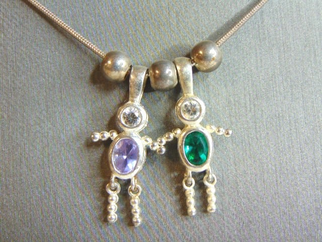 Womens Vintage Sterling Silver Kids Pendant & Necklace: A WOMENS VINTAGE ESTATE STERLING SILVER KIDS PENDANT WITH NECKLACE. PENDANTS SEEM TO HAVE AN AMETHYST AND DIOPSIDE, NOT SURE IF REAL OR MAN MADE. THE PENDANTS MEASURE 1 1/8" LONG BY 5/8" WIDE. NECKLAC