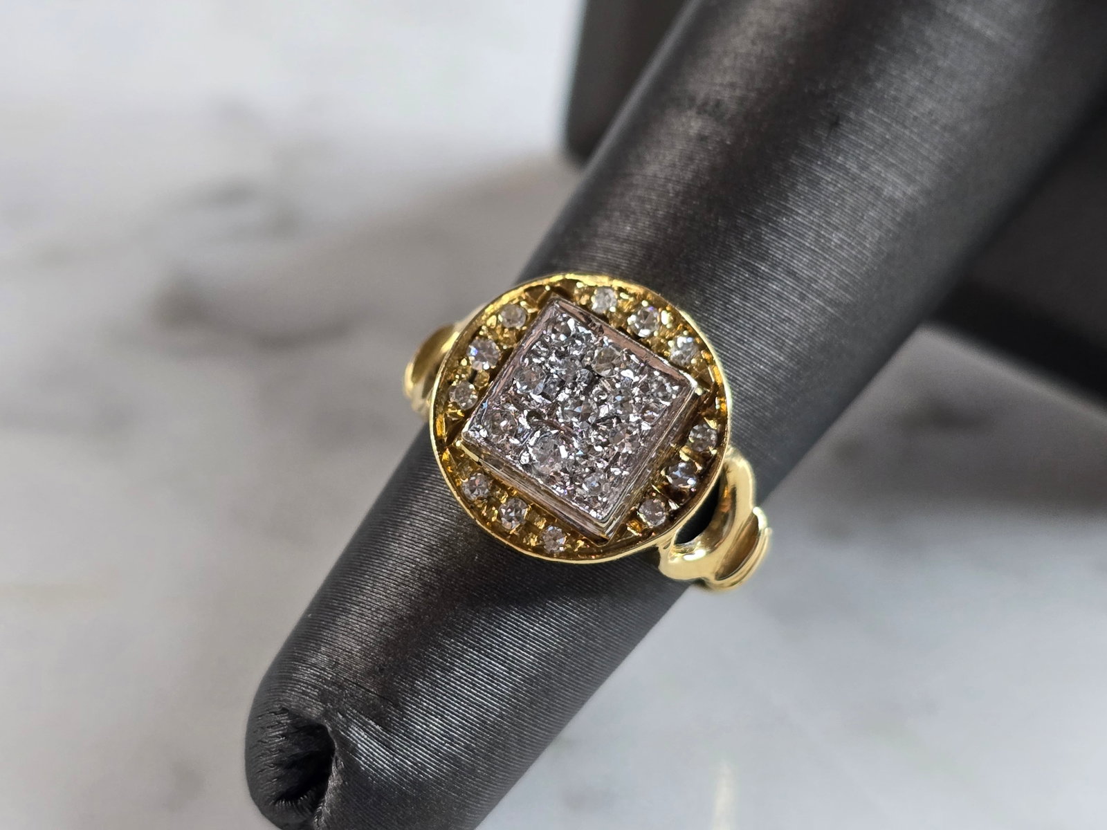 Womens Vintage Estate 18K Yellow Gold Diamond Ring: A WOMENS VINTAGE ESTATE 18K YELLOW GOLD DIAMOND RING. THE RING WEIGHS 4.1g, AND IS A SIZE 4.5. RING IS 1/2" WIDE, AND IS MARKED 18K. THERE ARE ABOUT 0.50cts OF DIAMONDS. ANY QUESTIONS PLEASE DONT HESI