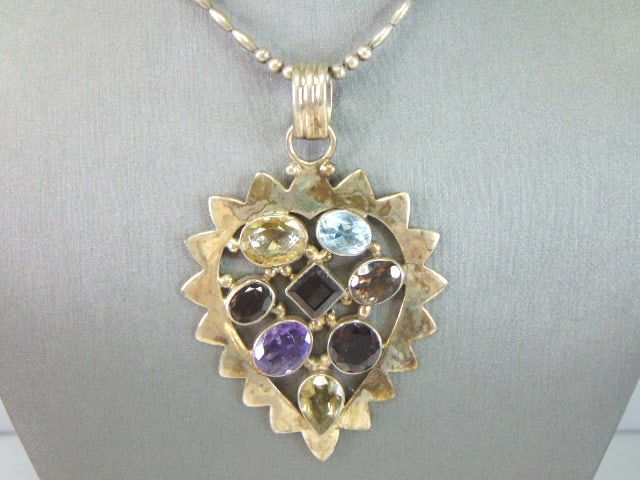 Womens Vintage Sterling Silver Multi-Stone Necklace: A VERY NICE STERLING SILVER MULTI STONE NECKLACE THAT WEIGHS 45.5g. NOT SURE IF STONES ARE NATURAL OR MAN MADE. THE PENDANT MEASURES 3 1/8" BY 2 1/8". THE NECKLACE MEASURES 24 5/8" LONG. ANY OTHER QUE