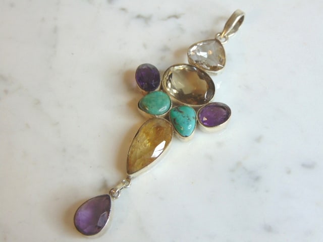 Womens Vintage Sterling Silver Multi Stone Pendant: A WOMENS VINTAGE ESTATE STERLING SILVER MULTI STONE PENDANT . PENDANT WEIGHS 25.4g AND PENDANT MEASURES 4 3/8" LONG BY 1 5/8" WIDE. MAKES A GREAT GIFT FOR THAT SOMEONE SPECIAL. ANY QUESTIONS, PLEASE A