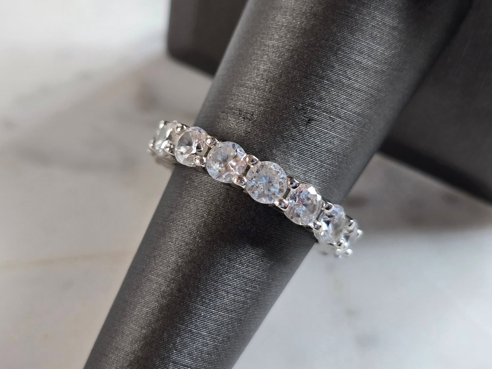 Womens Vintage Estate Sterling Silver Eternity CZ Ring: A WOMENS VINTAGE ESTATE STERLING SILVER ETERNITY CZ RING. THE RING SIZE IS A 7.0, AND WEIGHS 4.8g. THE WIDTH OF THE RING IS 3/16". THIS WOULD MAKE A NICE GIFT FOR THAT SOMEONE SPECIAL. ANY QUESTIONS P